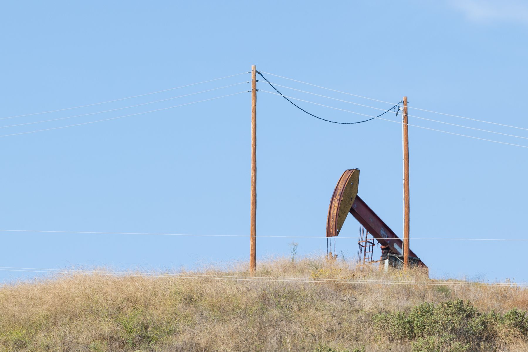 Pumpjack operating in a rural oil field